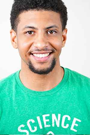 Man wearing a green t-shirt with a science graphic